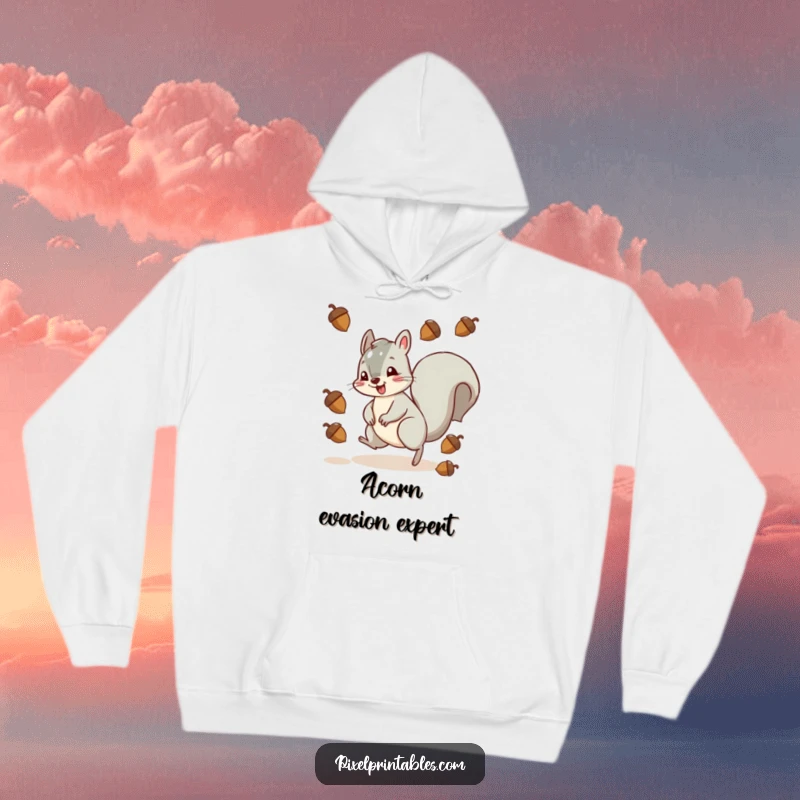 Funny squirrel character in a pixelated game scene, skillfully evading falling acorns, presented on a cozy hoodie.
