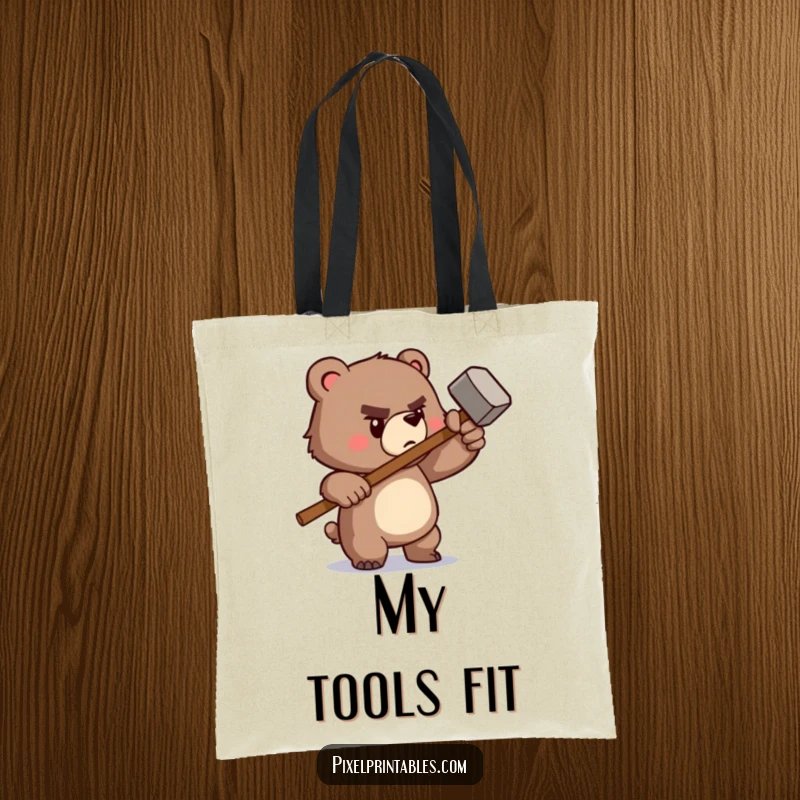 Funny tote bag featuring a determined pixelated bear wielding a tiny pixelated hammer, perfect for carrying tools with retro flair.